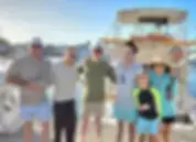 A group of happy anglers on the dock after a charter fishing trip