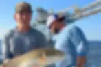 Angler holding a mangrove snapper caught near Key West