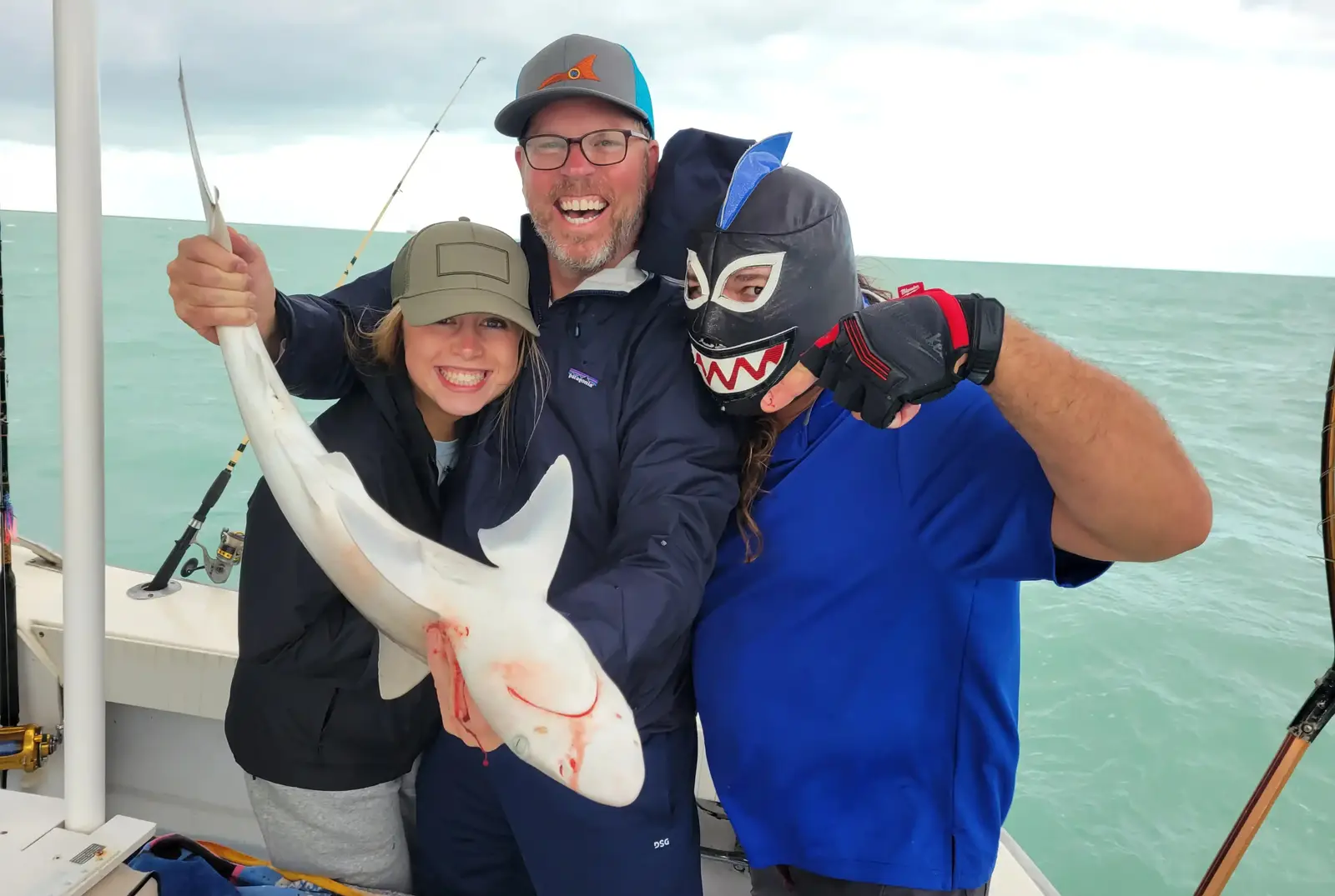 Angler holding a red grouper caught near Key West