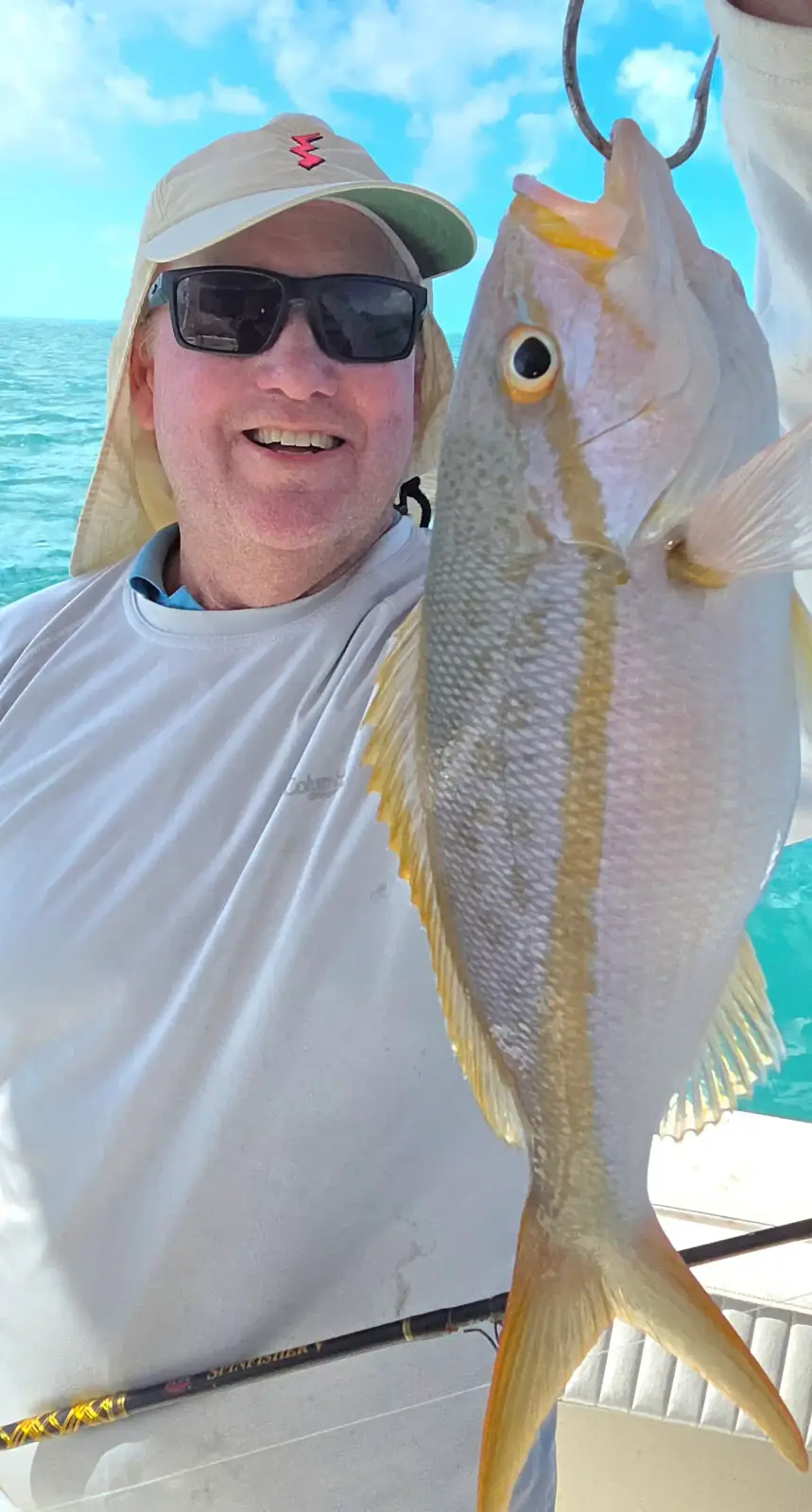A group of happy anglers on the dock after a charter fishing trip