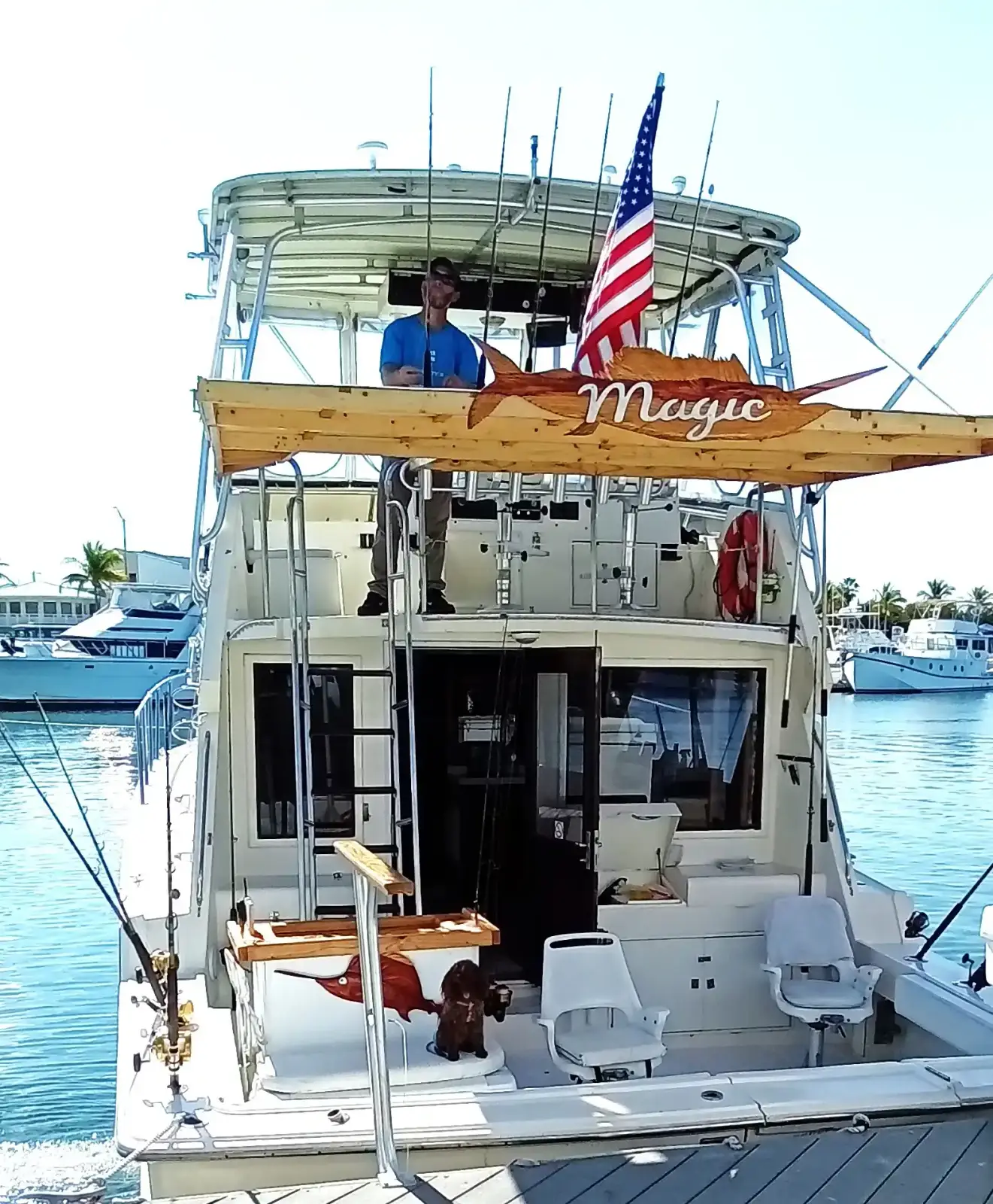 Captain Barry Spieler and his dog aboard the Magic at the dock